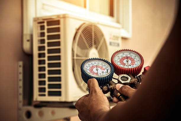 Professional Air Conditioning Service technician working in Camden, NY